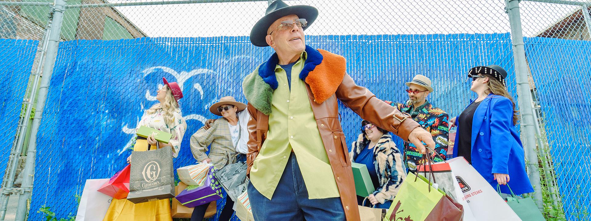 Loudly dressed people, focal point main with hat & big coat